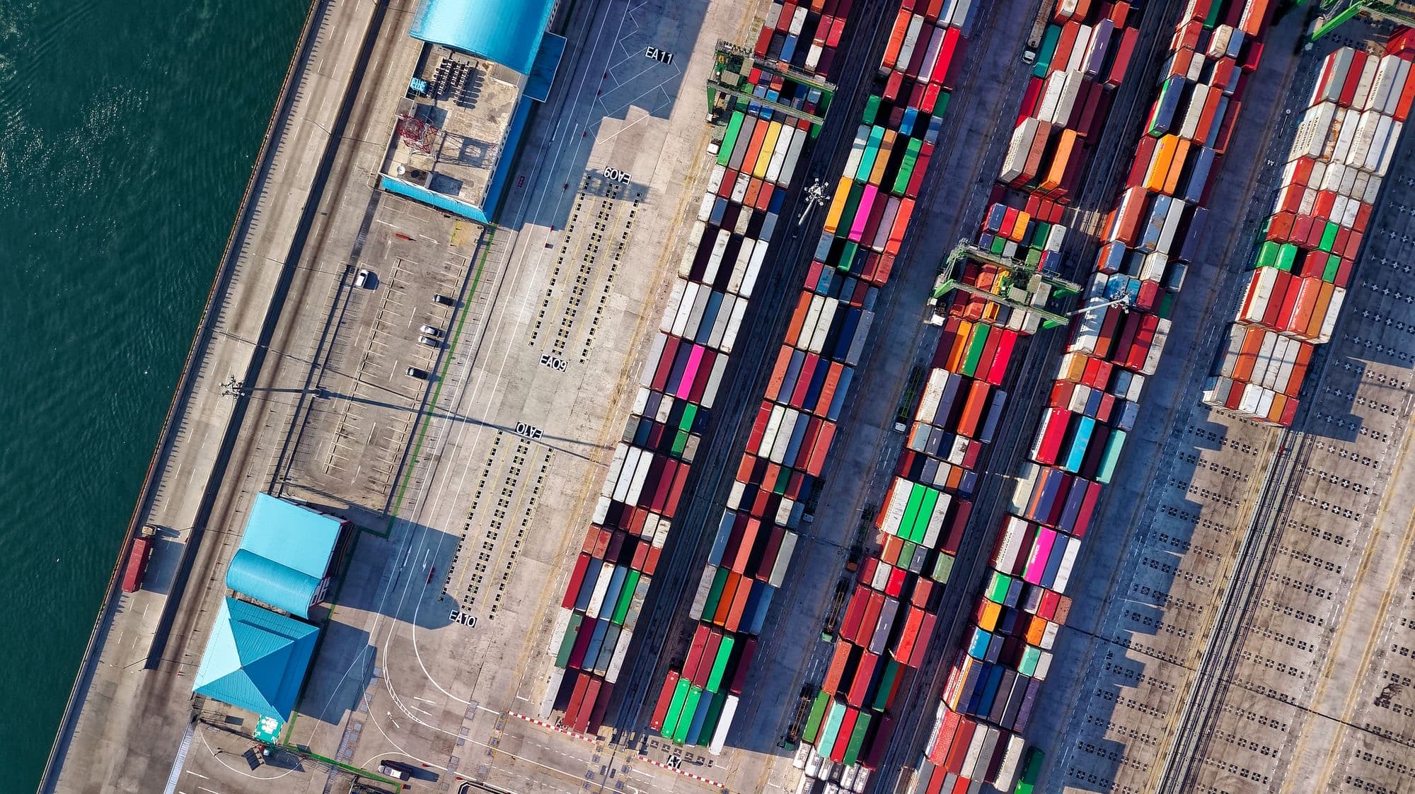 Aerial view of rows of shipping containers at a port terminal