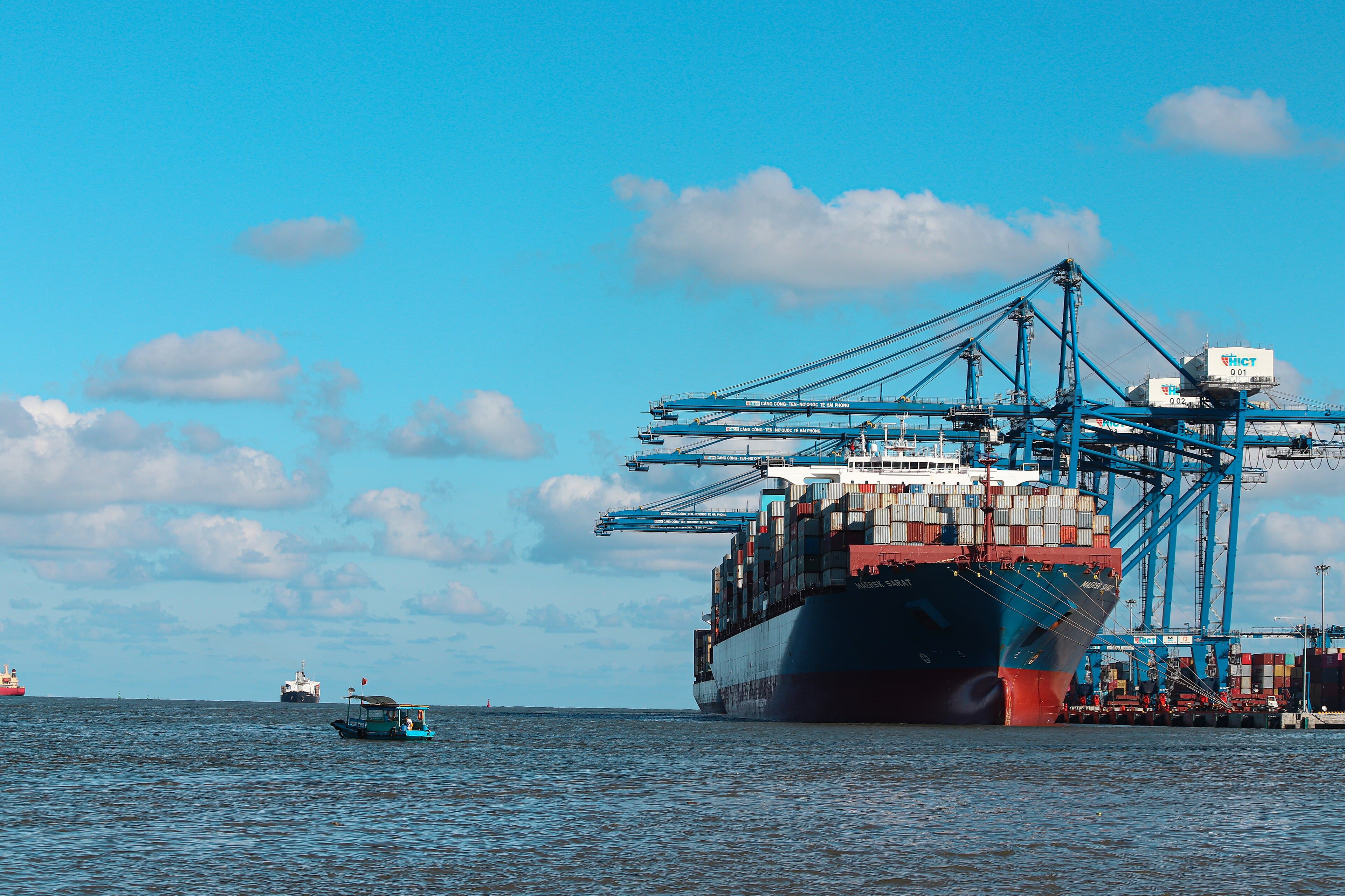 A container ship alongside gantry cranes at the Hai Phong International Container Terminal